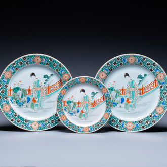 A pair of Chinese famille verte dishes and a plate with a mother and her son, Kangxi