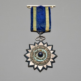 An imperial Chinese stone-inlaid enamelled metal 'Order of the Double Dragon' award medal, awarded on Oct. 5, 1905