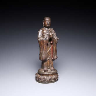 A Chinese gilt bronze standing Buddha, Ming