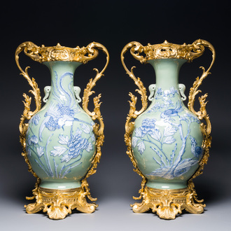 A pair of Chinese blue and white celadon-ground vases with gilt bronze mounts, 19th C.