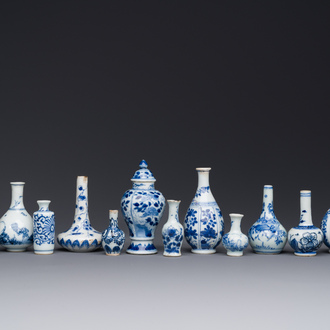 Fourteen Chinese blue and white miniature vases with floral design, Kangxi
