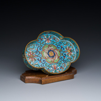 A Chinese quadrifoil cloisonné dish with floral design on wooden stand, Yongzheng