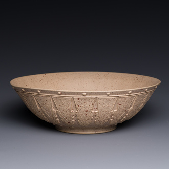 A large Chinese Yixing stoneware bowl with relief design, Qianlong mark, 18/19th C.