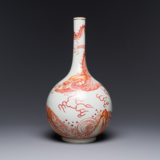 A Chinese iron-red-decorated and gilt 'dragon and carp' bottle vase, 19/20th C.