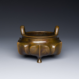 A Chinese bronze lotus-shaped tripod censer, Xuande mark, 18/19th C.