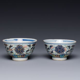 A pair of Chinese doucai 'lotus scroll' cups, Guangxu mark and of the period