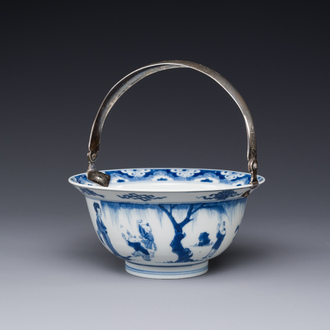 A Chinese blue and white bowl depicting playing boys and ladies with a mounted silver handle, Chenghua mark, Kangxi