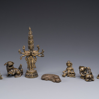 A collection of Chinese and Sino-tibetan bronze sculptures and paper weights, Qing