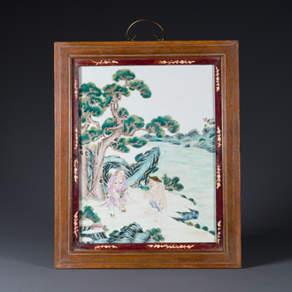 A Chinese famille rose 'two sages in the mountain' plaque in a wooden frame, 18/19th C.