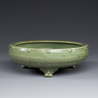 A Chinese Longquan celadon tripod censer on wooden stand, Yuan/Ming