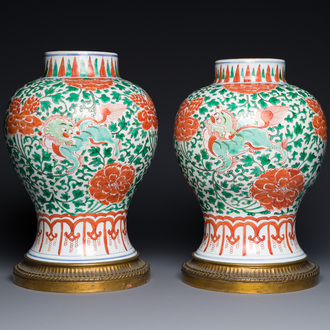 A pair of Chinese famille verte 'Buddhist lion' vases with gilt bronze mounts, Kangxi