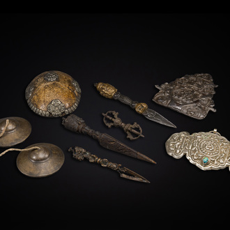 Four Tibetan bronze and wooden phurbas, a 'kapala' or skull-bowl, a pair of brass tingsha and two silver ornaments,  19th C.