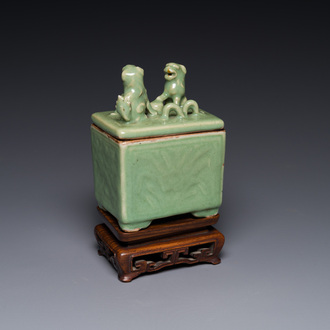 A Chinese Longquan celadon rectangular censer and cover on wooden stand, Ming