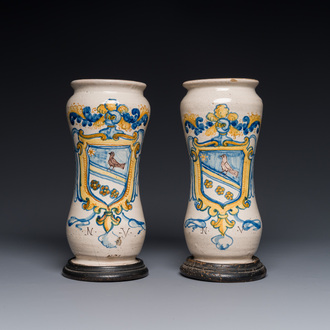 A pair of polychrome Italian maiolica armorial albarelli monogrammed NV, Naples, 2nd half 17th C.