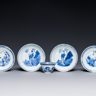 Four Chinese blue and white saucers and an 'erotic' cup, Kangxi