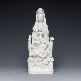 A Chinese Dehua blanc de Chine group of Guanyin with a child and servants, 18th C.