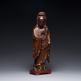 A Chinese partly gilt and lacquered wooden sculpture of Guanyin, Ming