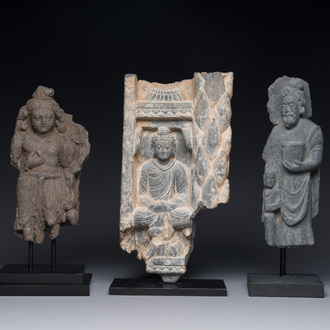 A Gandhara grey schist sculpture of the Bodhisattva Maitreya, a fragment of a seated Buddha and a sculpture of a master with a child, 1/5th C.
