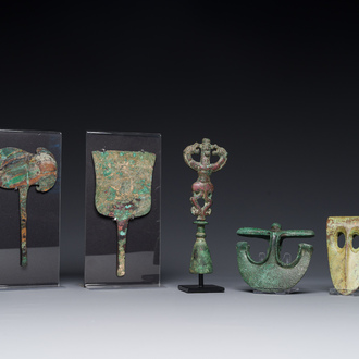 A collection of three bronze axes, a mirror and an anthropomorphic idol with two dragon heads, Luristan, 2000 B.C and earlier