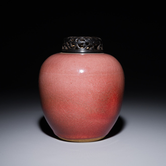 A Chinese monochrome copper-red-glazed ginger jar with a reticulated wooden cover, 18/19th C.