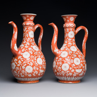 A pair of rare Chinese iron-red-enamelled 'chrysanthemum scroll' ewers, Kangxi