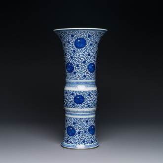 A Chinese blue and white 'chrysanthemum scroll' 'gu' vase, Kangxi