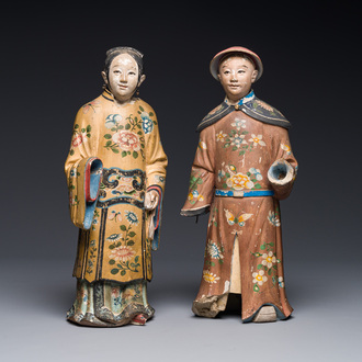 A pair of Chinese export polychrome decorated clay nodding head figures, 18/19th C.