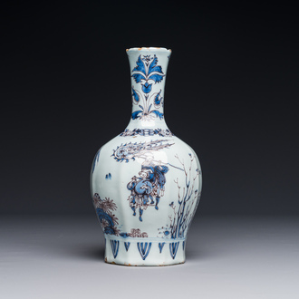 A fine Dutch Delft blue, white and manganese chinoiserie bottle vase, late 17th C.
