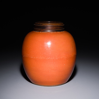 A Chinese monochrome coral-red-glazed ginger jar with wooden cover, 18th C.