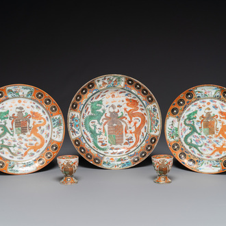 Three Chinese Canton famille rose armorial plates and a pair of egg cups for the Portugese market, Guangxu