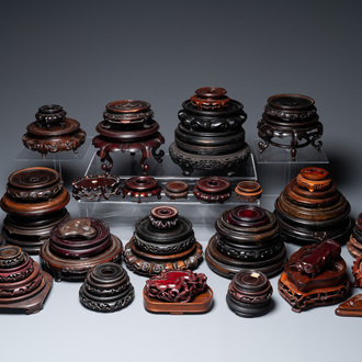 A large collection of 58 varied Chinese wooden stands, 19/20th C.