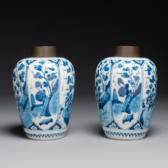 A pair of Dutch Delft blue and white chinoiserie vases with wooden covers, 18th C.