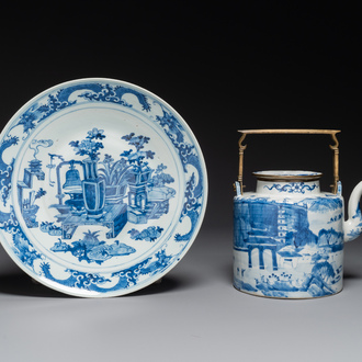 A Chinese blue and white teapot with landscape design and an 'antiquities' dish, 19th C.