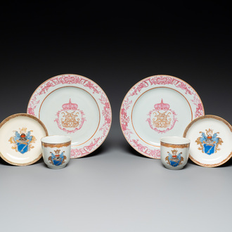 A pair of monogrammed Chinese puce-enamelled plates and a pair of armorial cups and saucers, Yongzheng/Qianlong