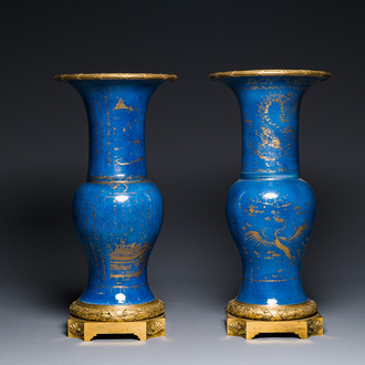 Een paar Chinese poederblauwe 'yenyen' vazen met verguld decor en vergulde bronzen monturen, Kangxi