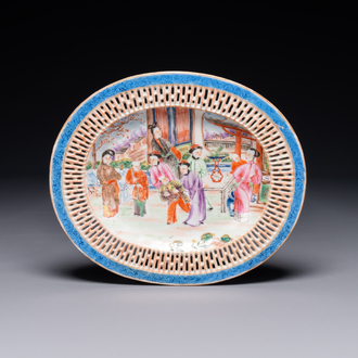An oval Chinese Canton famille rose dish with a reticulated border, 19th C.
