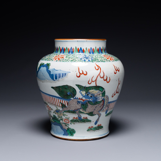 A Chinese wucai 'qilin' baluster vase, 19th C.