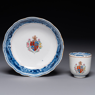 A Chinese famille rose armorial cup and saucer, Qianlong