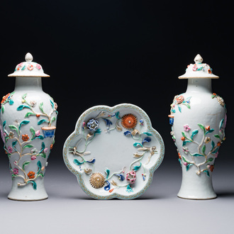 A pair of Chinese famille rose covered vases and a plate with applied floral design, Yongzheng