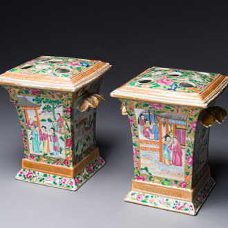 A pair of Chinese Canton famille rose bough pots and covers, 19th C.