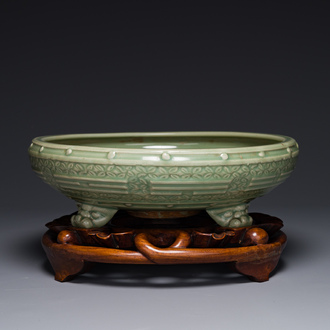 A large Chinese Longquan celadon 'trigrams' censer on wooden stand, Ming
