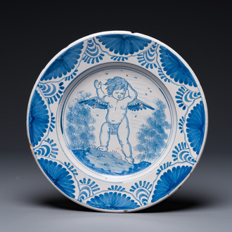 An attractive blue and white Dutch maiolica dish with a winged cherub, probably Harlingen, 2nd half 17th C.
