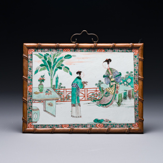 A rectangular Chinese famille verte plaque in a wooden faux bamboo frame, Kangxi