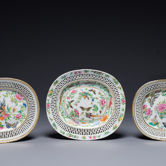 Three Chinese Canton famille rose reticulated oval dishes with flowers, butterflies and marine animals, 19th C.