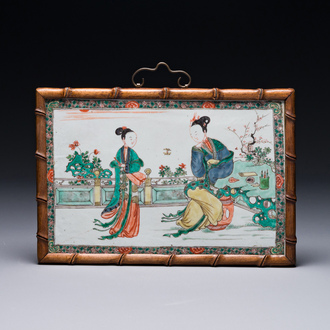A rectangular Chinese famille verte plaque in a wooden faux bamboo frame, Kangxi