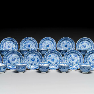 Eleven Chinese blue and white 'crab and fish' cups and saucers, Kangxi mark, Guangxu