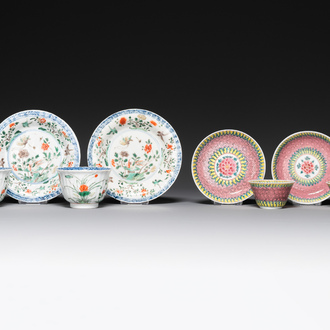 A pair of Chinese famille verte and a pair of famille rose cups and saucers, Kangxi/Yongzheng