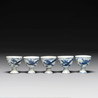 Five Chinese blue and white 'Hatcher cargo' stem cups with dragons, Transitional period