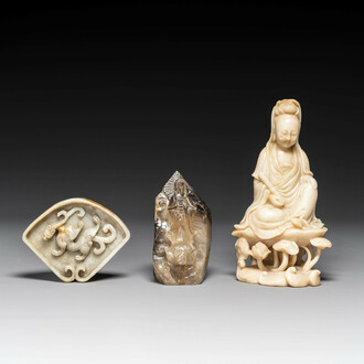 A Chinese soapstone and a crystal figures of Guanyin and a jade 'chilong' plaque, 19th C.