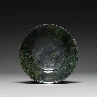 A Chinese dark green jade bowl, 18th C.